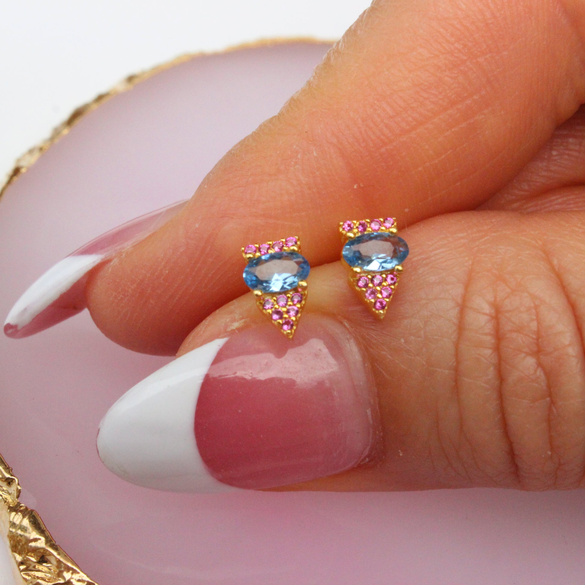 blue main stone with small pink stones, triangle stud earring