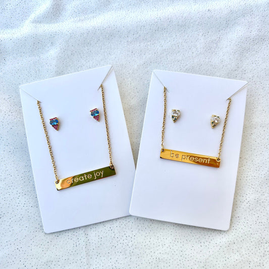 gold necklaces and earrings on cards